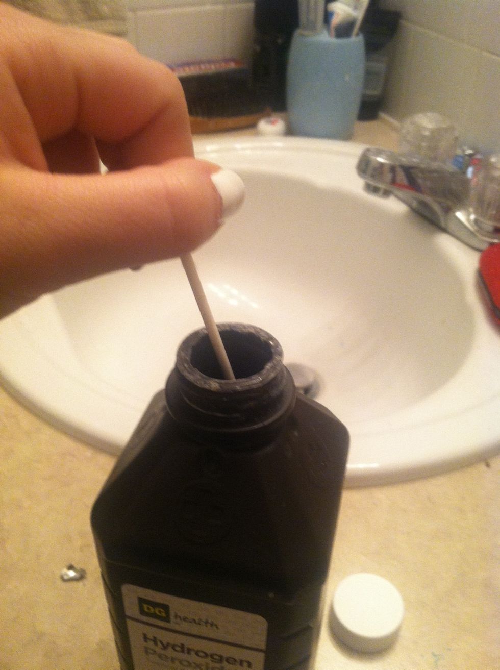 Take a q-tip and dip it into the peroxide.