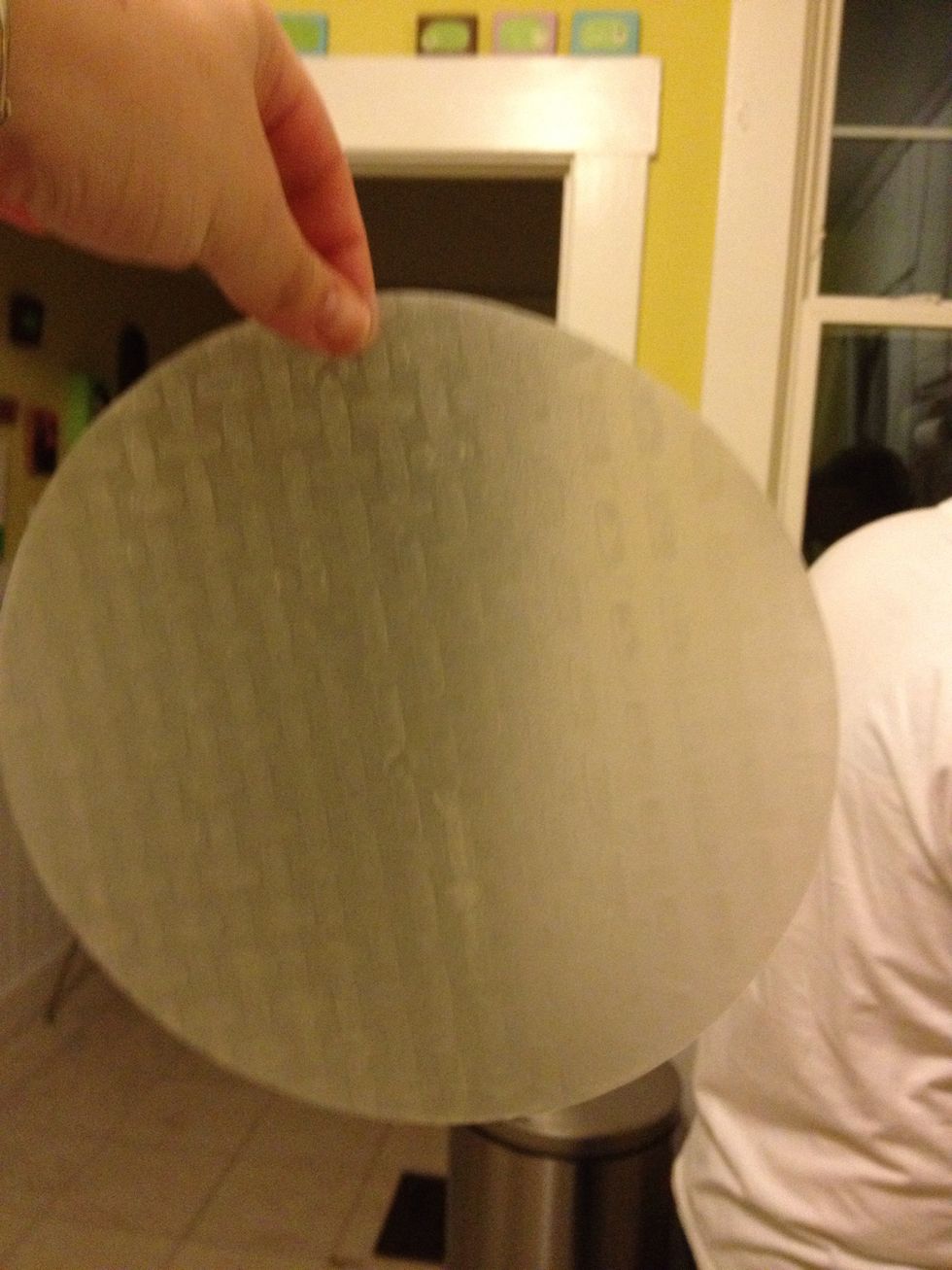 take a rice paper wrapper and place gently into a bowl of warm water and move around for 10 seconds until it is soft.