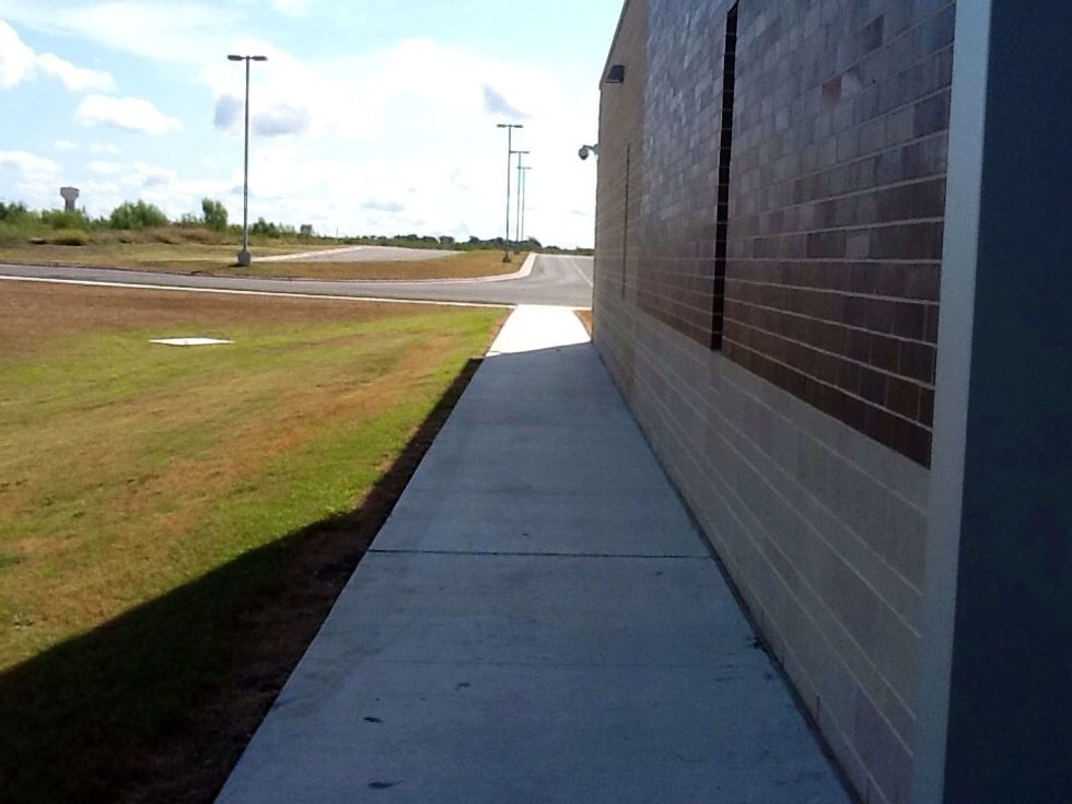 Take a right out of the building. WALK down the sidewalk.