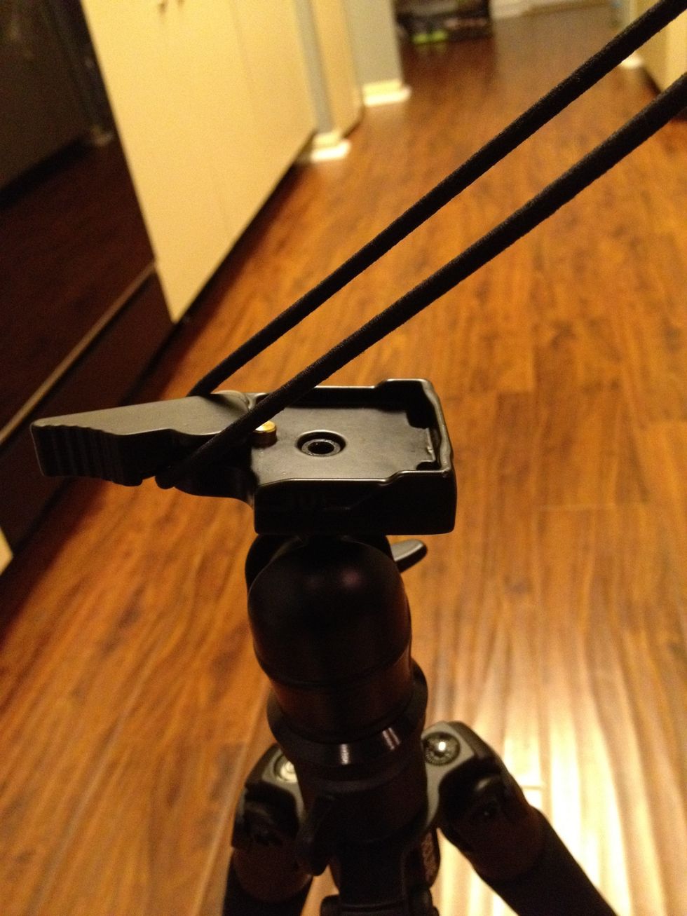 Take a rubber band, hair tie, or hand band. (anything stretchy) and put it around the release handle.