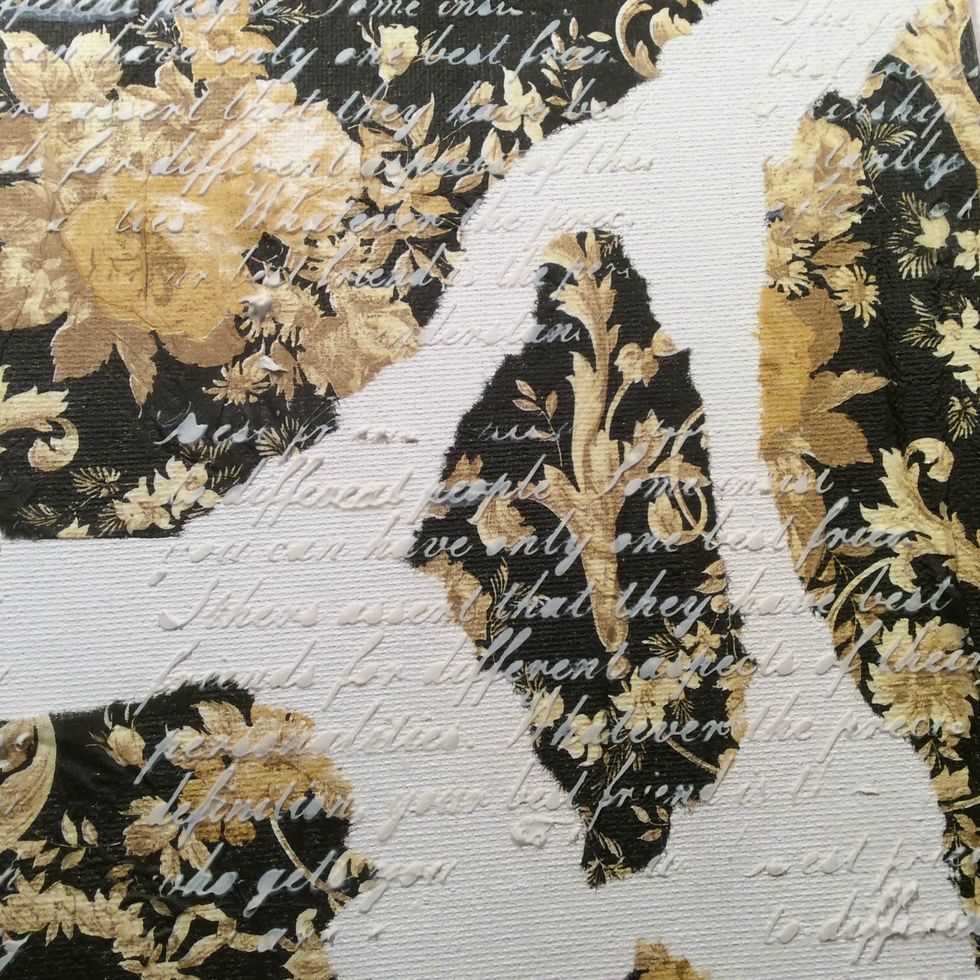 Take a script stencil and modeling paste and add randomly to your canvas for texture.