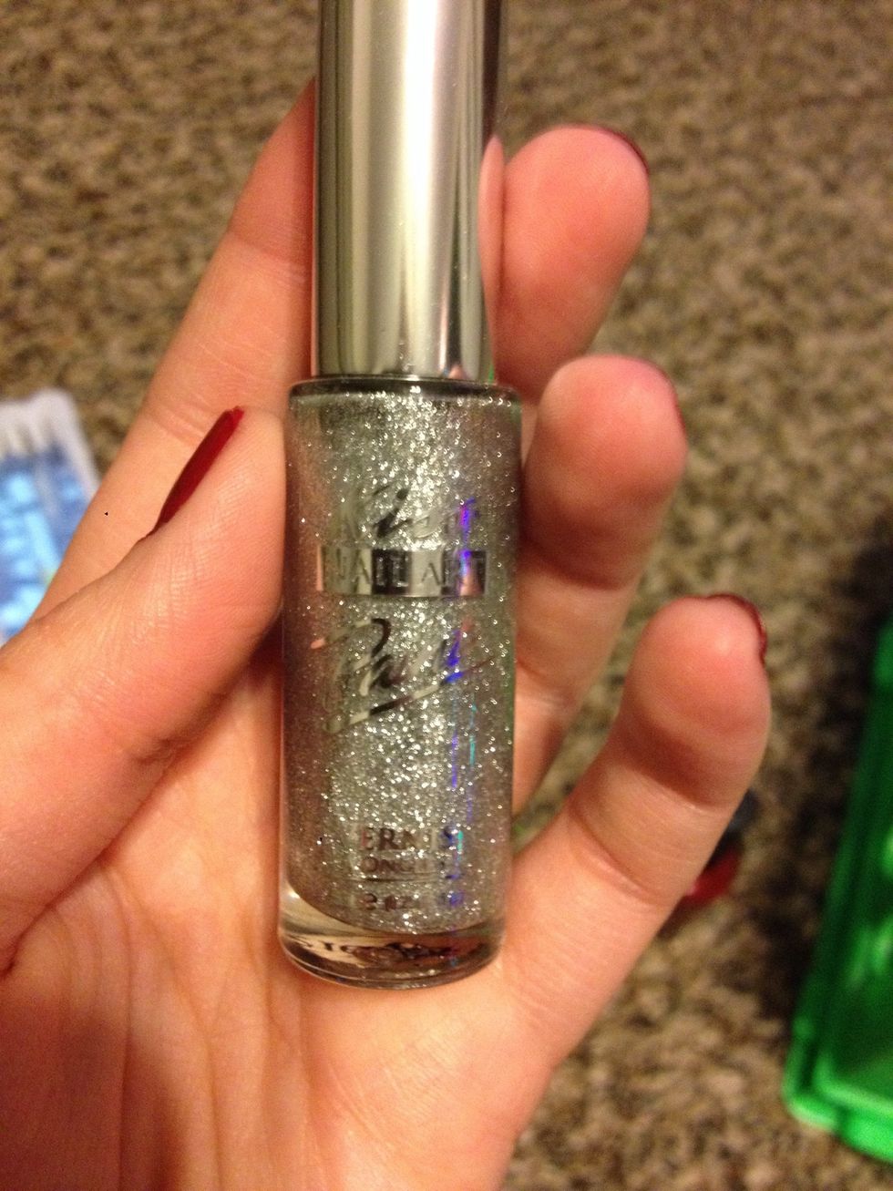 Take a silver with a nail art brush