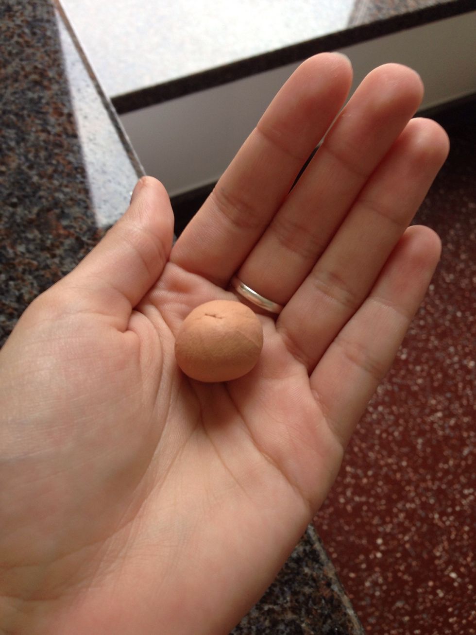 Take a small amount of the soft plastic and form a ball