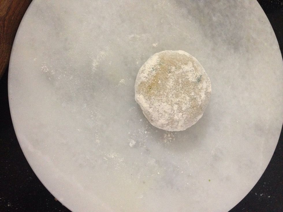 Take a small ball of dough apply some flour to so it doesnt stick when its rolled out