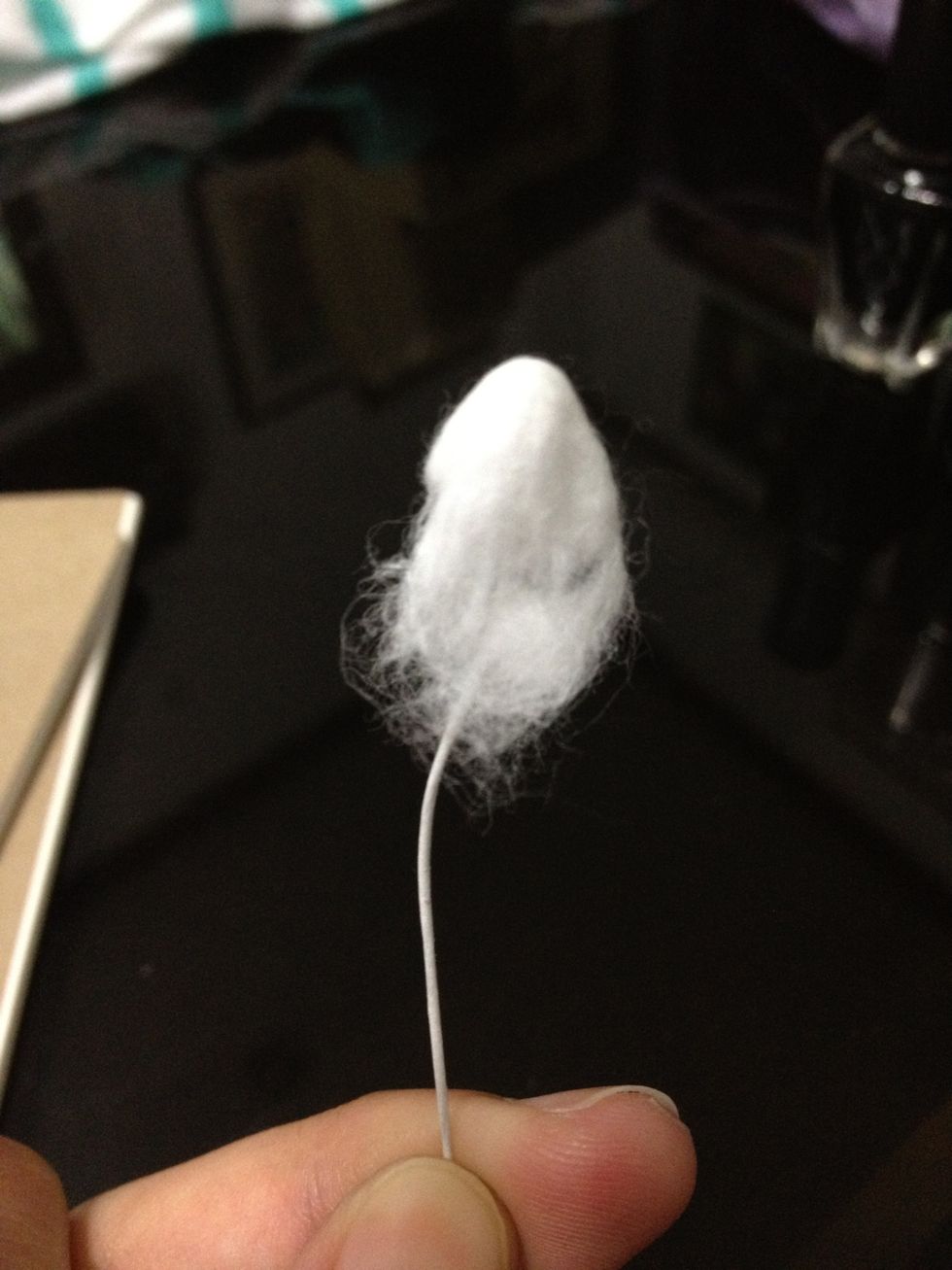 Take a small piece of cotton pad and place it over the loop.