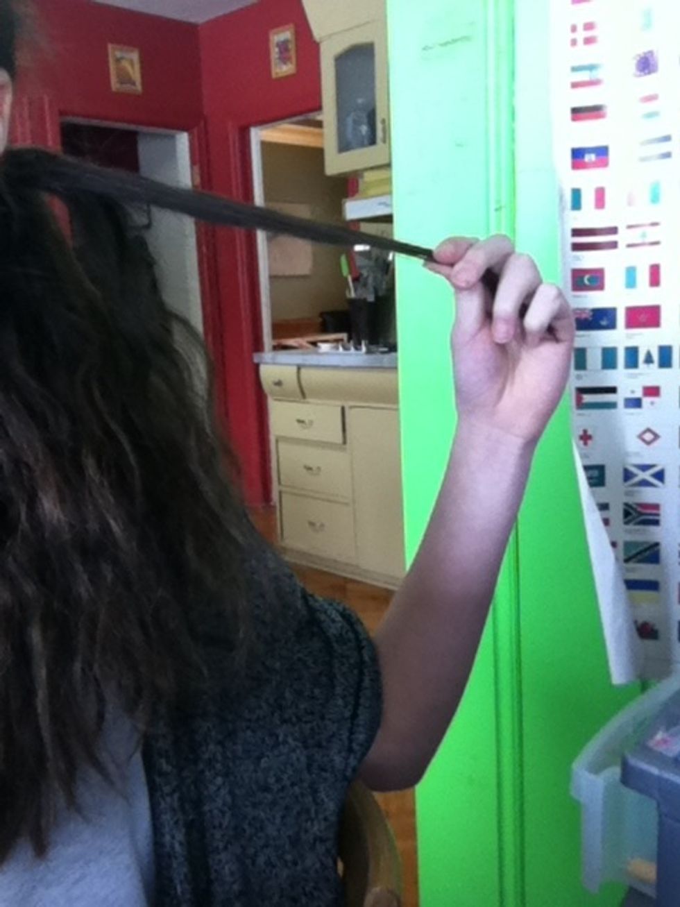 Take a small piece of hair from one side