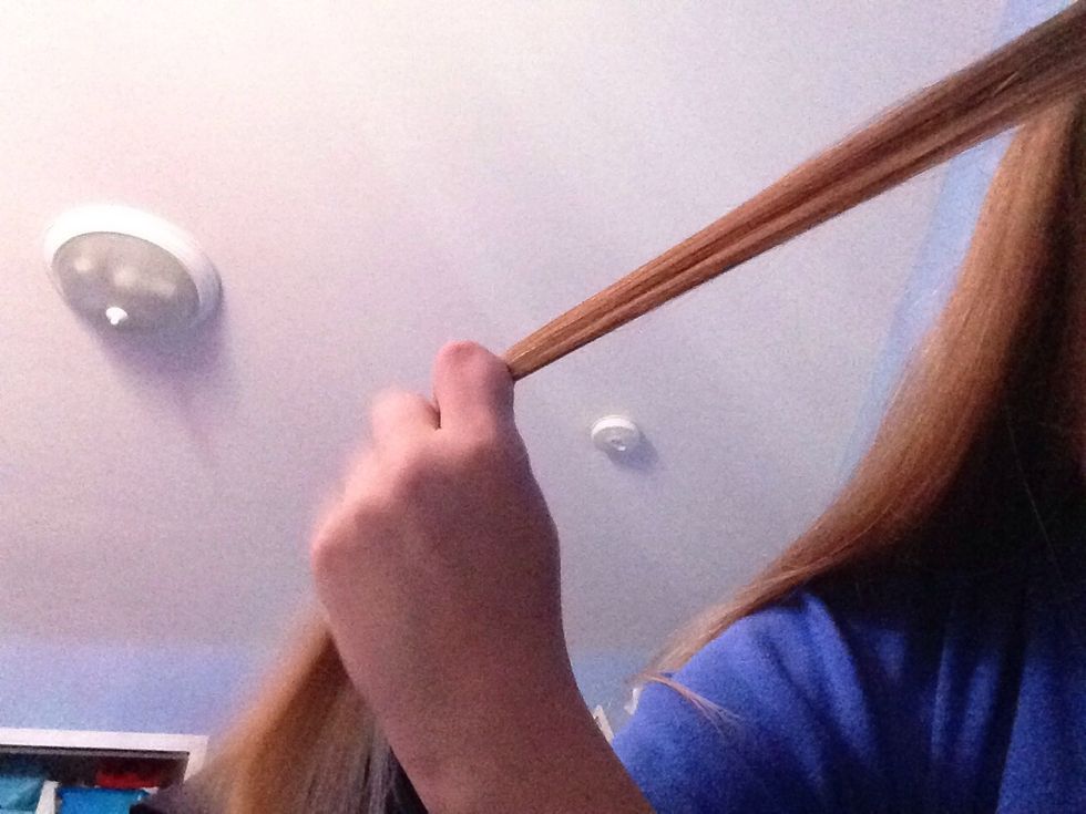 Take a small section of hair