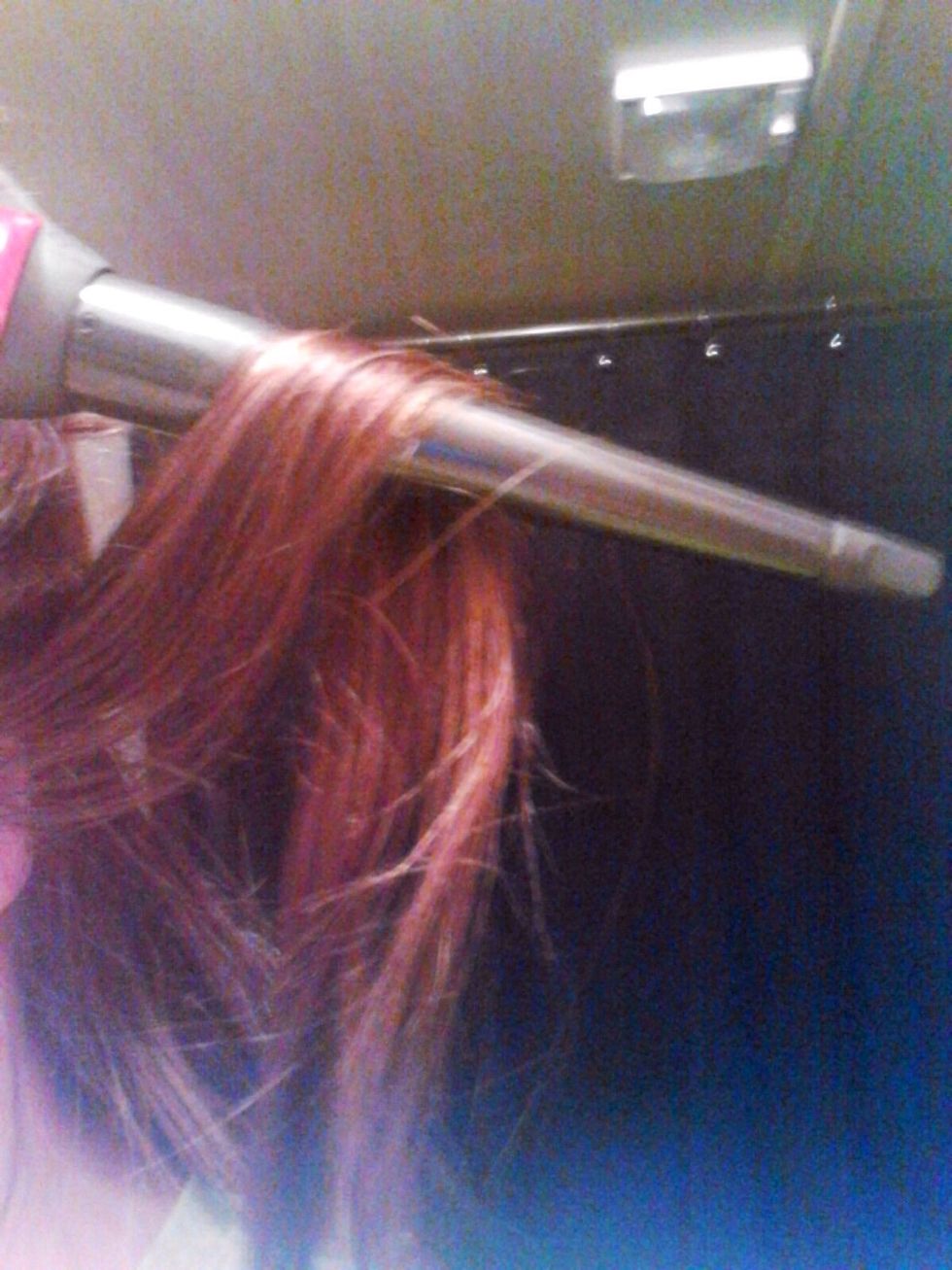 Take a small section of your hair and place the wand behind the section of hair. Wrap your hair around the wand using an "over and under" technique, wrapping your hair over the wand then under.