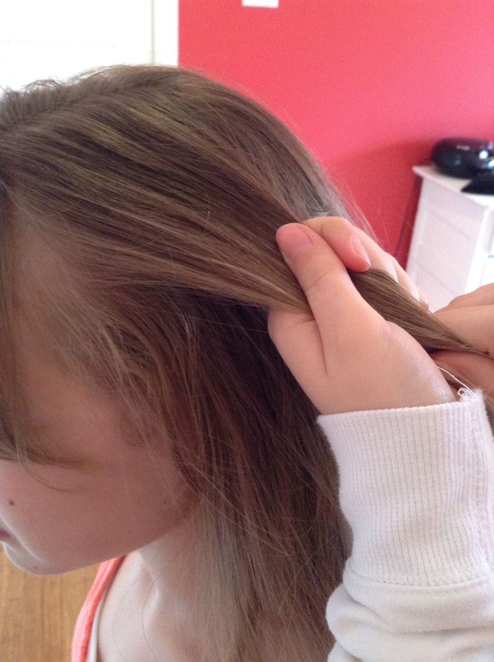 Take a small section on top of your head...