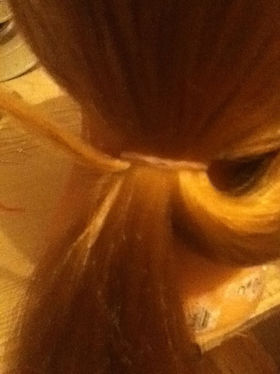 Take a small strand from the left hand side