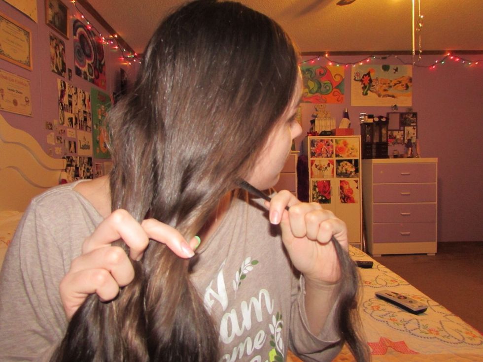 Take a SMALL strand of hair out from behind the right-most side. Once you have done that, take the strand and cross it over to the other half of your hair.