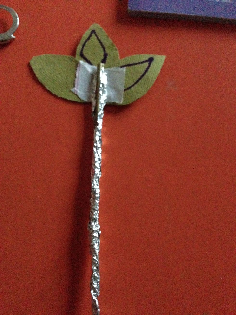 Take a small white or any other paper and stick it . Next tightly stick the stick on the paper as shown