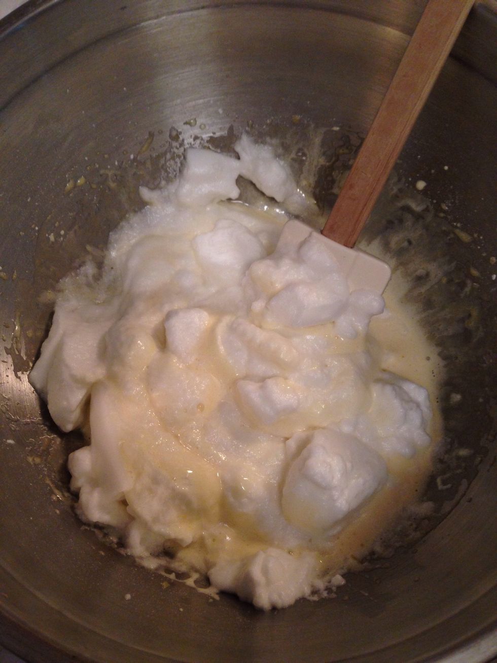 Take a spatula, dump your whites in the yolks bowl and slowly combine. No stirring! More like lifting it up from the bottom, you want it to stay fluffy.