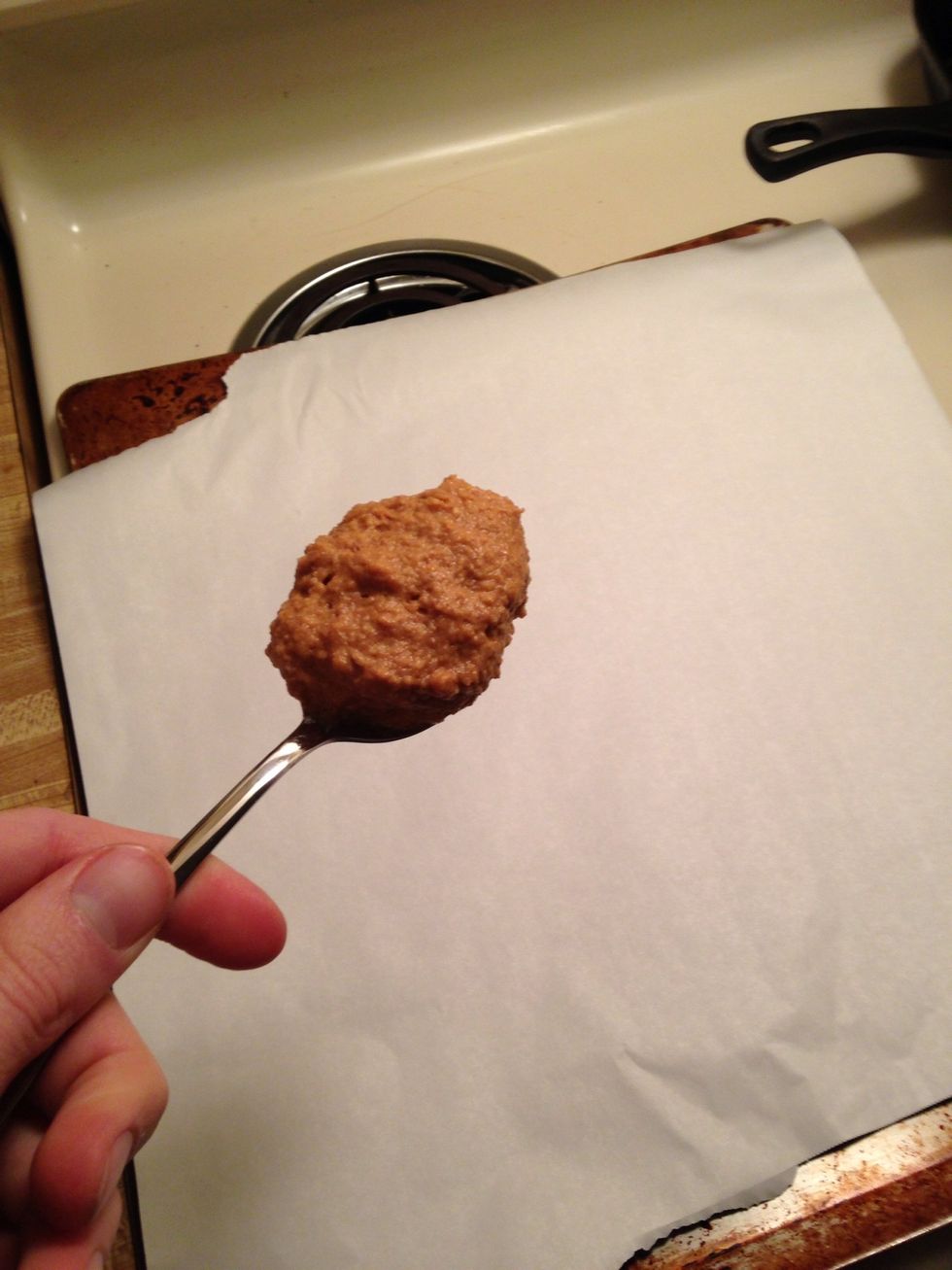 Take a spoon and form even size cookies on the baking sheet