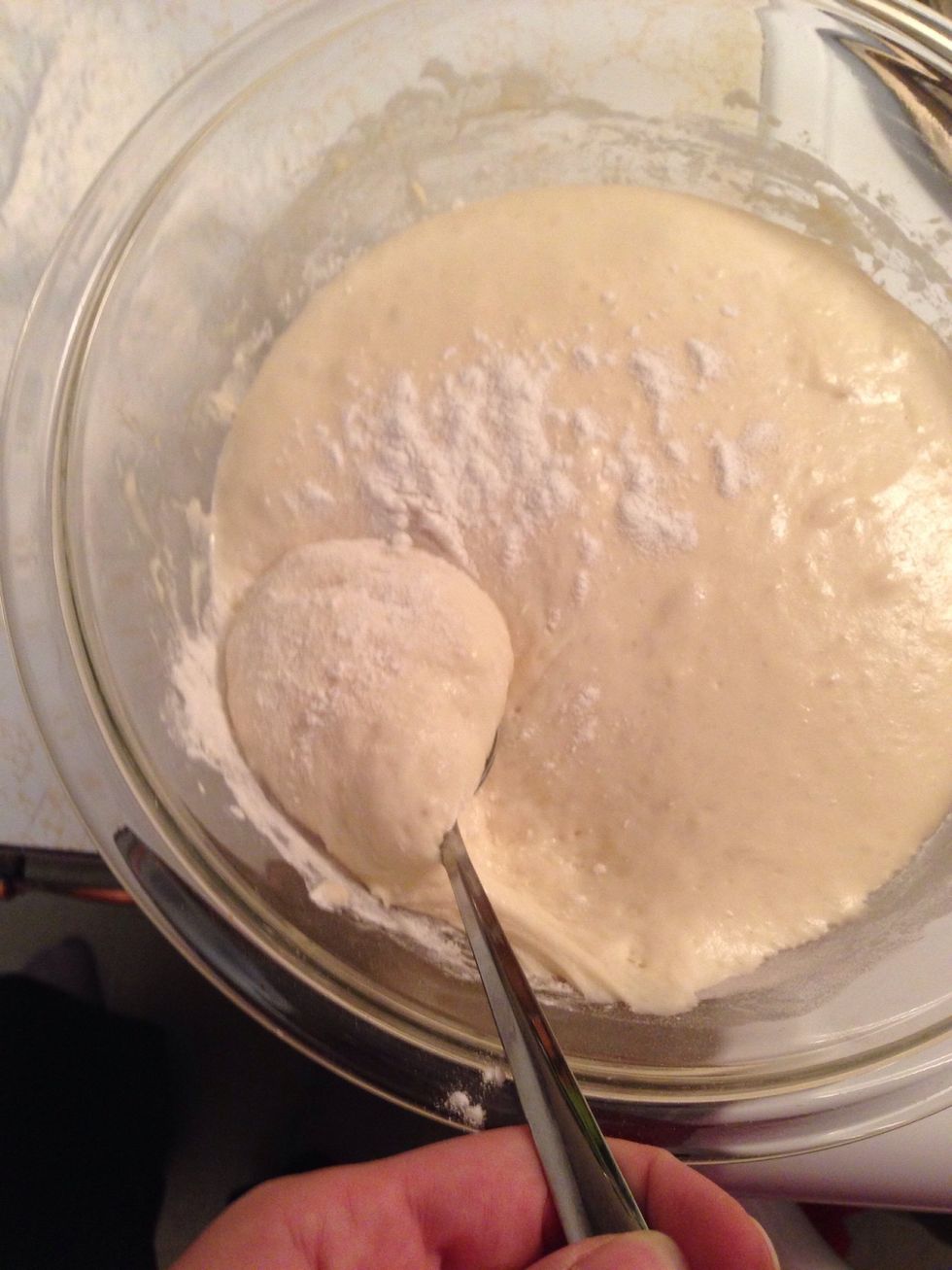 Take a spoon and get a chunk of your dough and place it on your counter with flour.