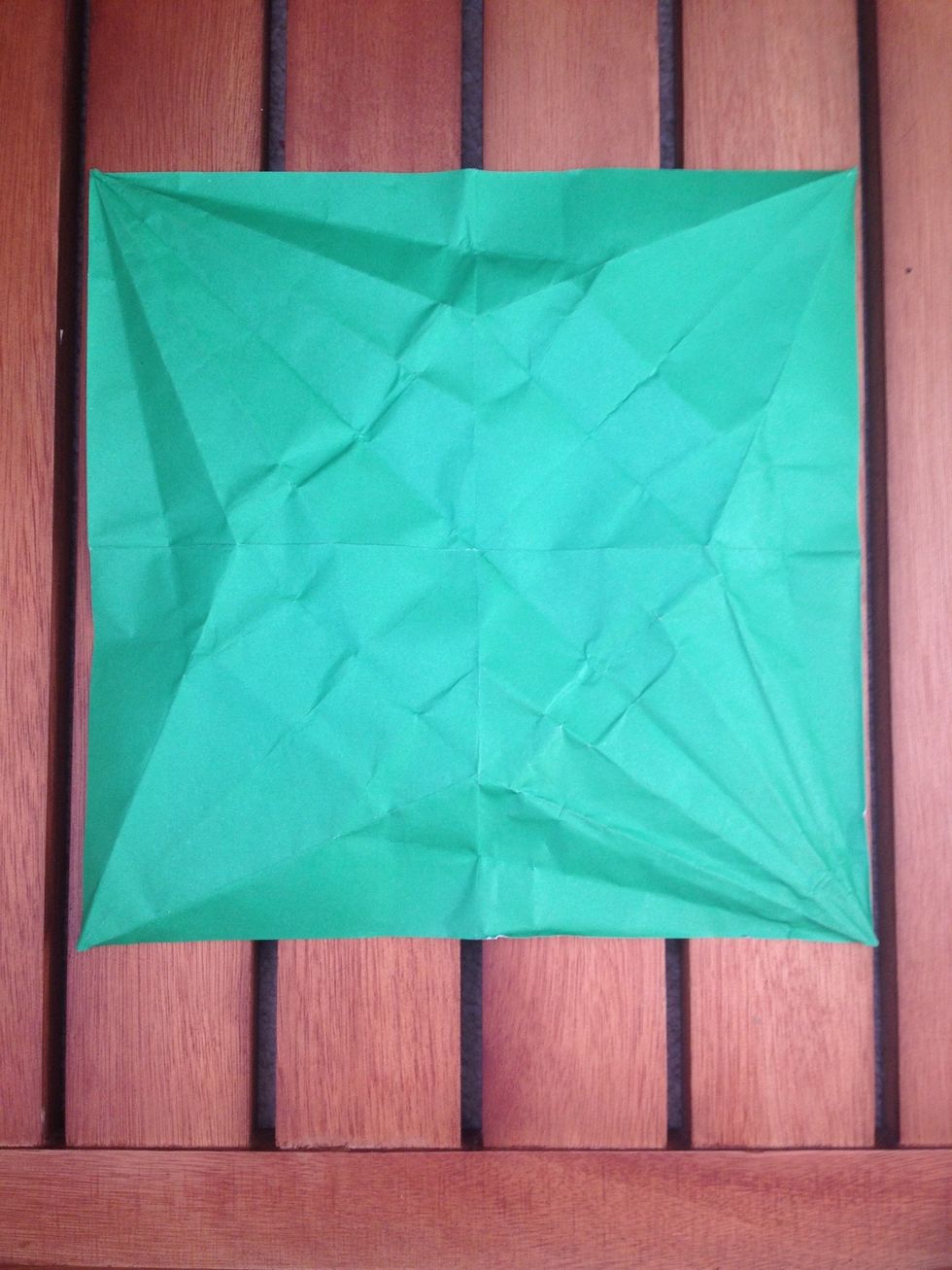 Take a square piece of paper, whatever size you want. Mine is a piece of A4 with the bottom cut off (and crumpled because I'm reusing it).