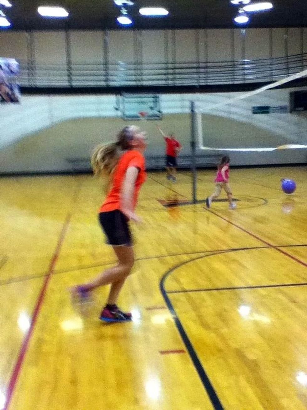 Take a step with your left foot so you are closer to the net.