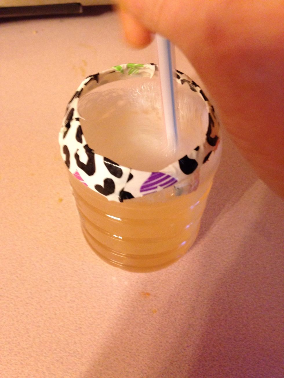 Take a straw or spoon, or something else to stir the soap and water