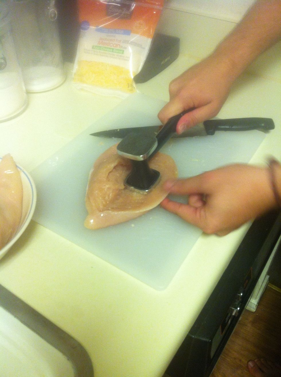Take a tenderizer to each piece, but only beat in the center of the breast. (Notice I leave a little edge around the outside of breast so as to create a cavity for stuffing)