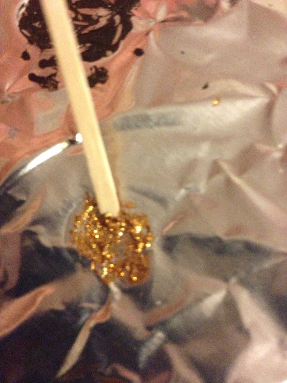 Take a toothpick (I used flat toothpicks, so make sure you flatten the tip) and dip it into the dot.