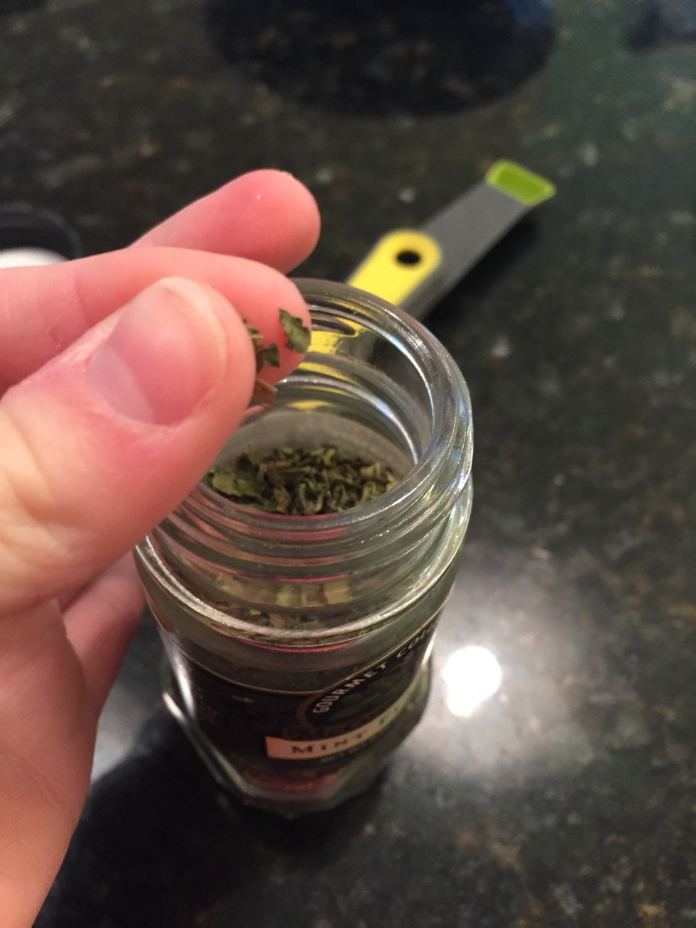 Take a very small pinch of mint leaves or flakes and add those into the bowl