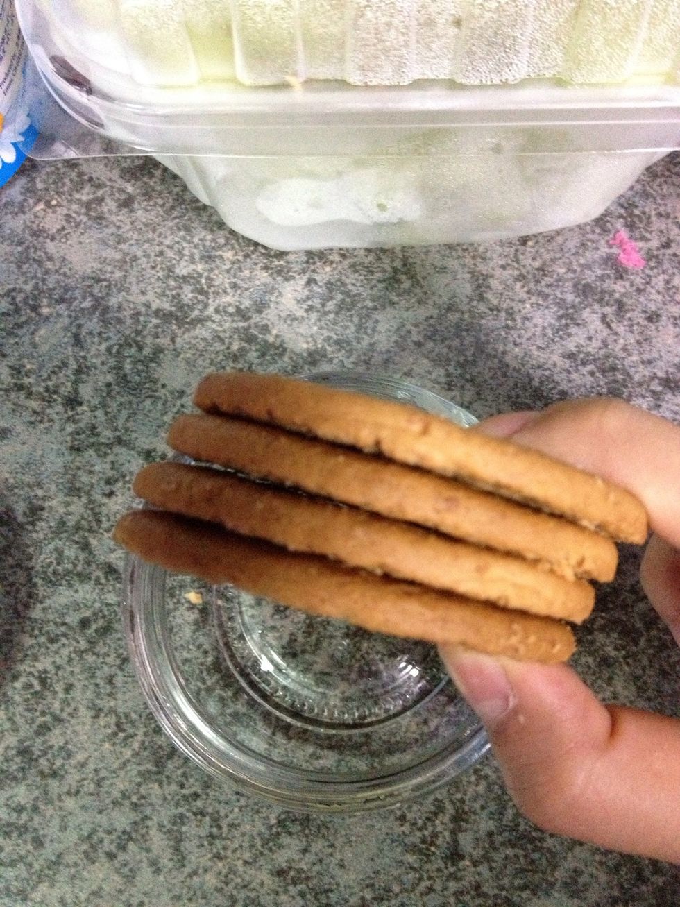Take about 4 digestive biscuits. To smash them for the base and the top coat.