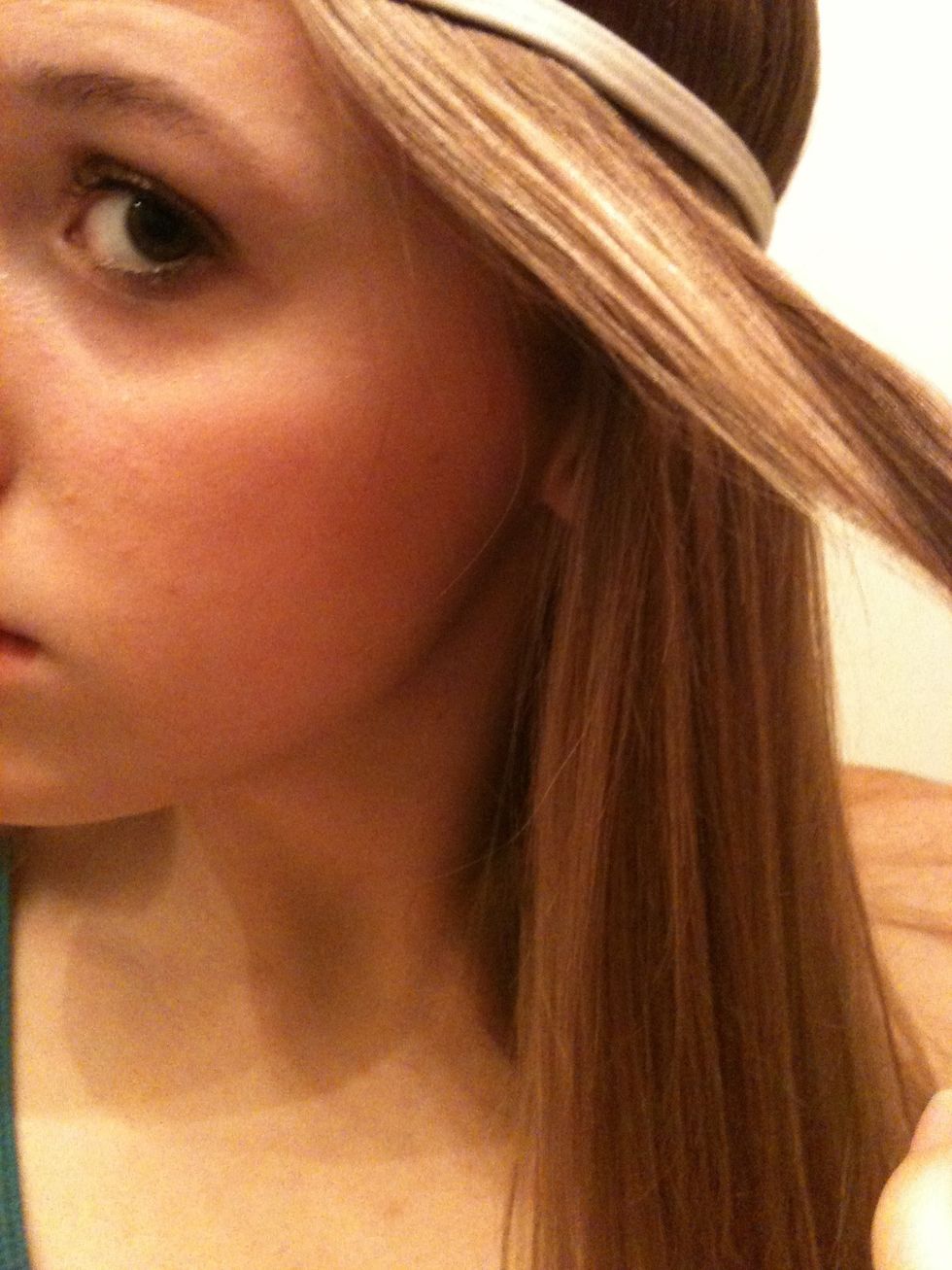 Take about a 1 inch section of hair, starting in the front, and wrap it around the band.