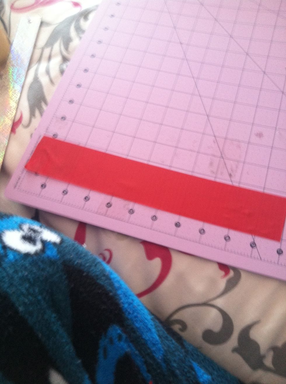 Take about an 11 inch strip of any color duct tape your going to probably want 3 different colors of duct tape for this project so it will look the coolest