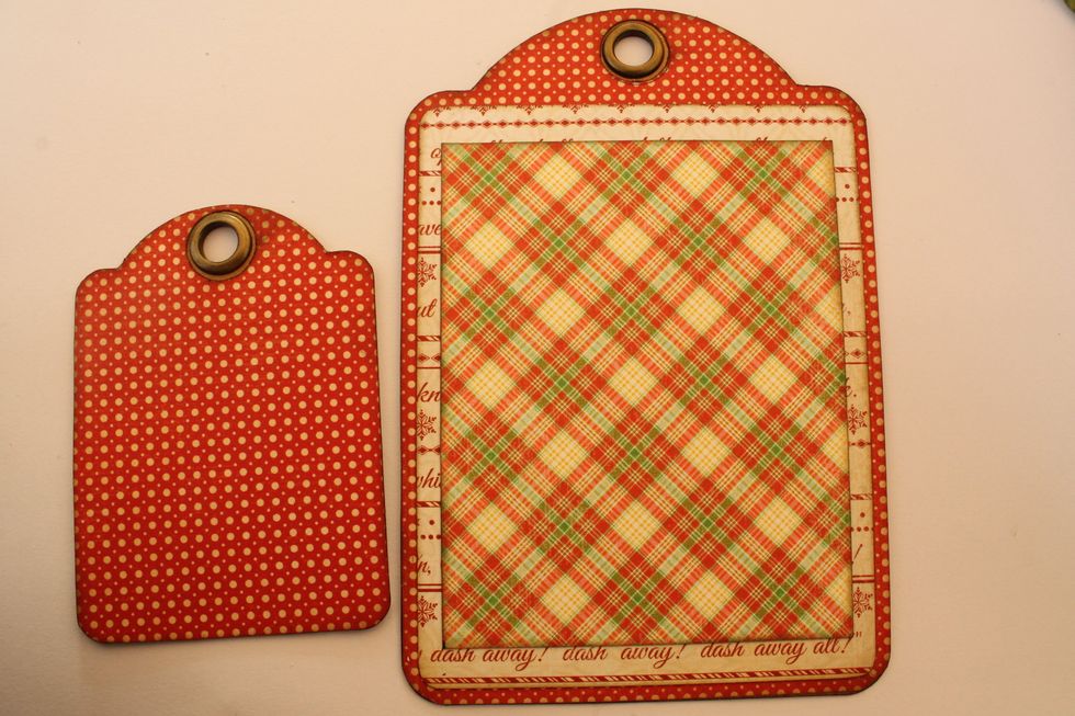 Take an ATC tag and cut out a tag of the same size from a sheet of red polka dot paper. Attach it on top of the ATC tag.