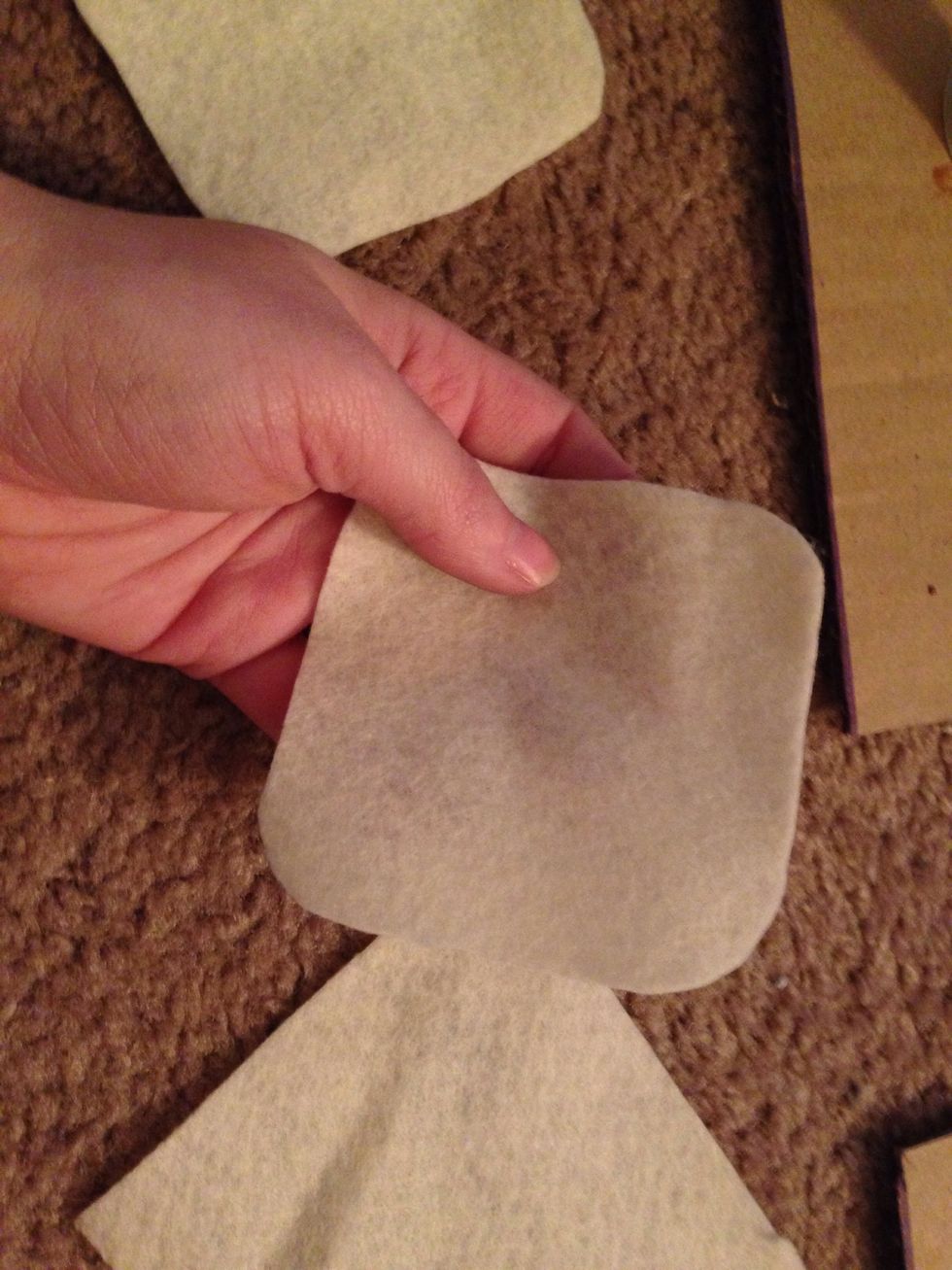 Take an extra chipboard square and trace it onto the felt sheet (one for each coaster) then cut them out. (I decided on a different color felt than pictured on the supplies step FYI)