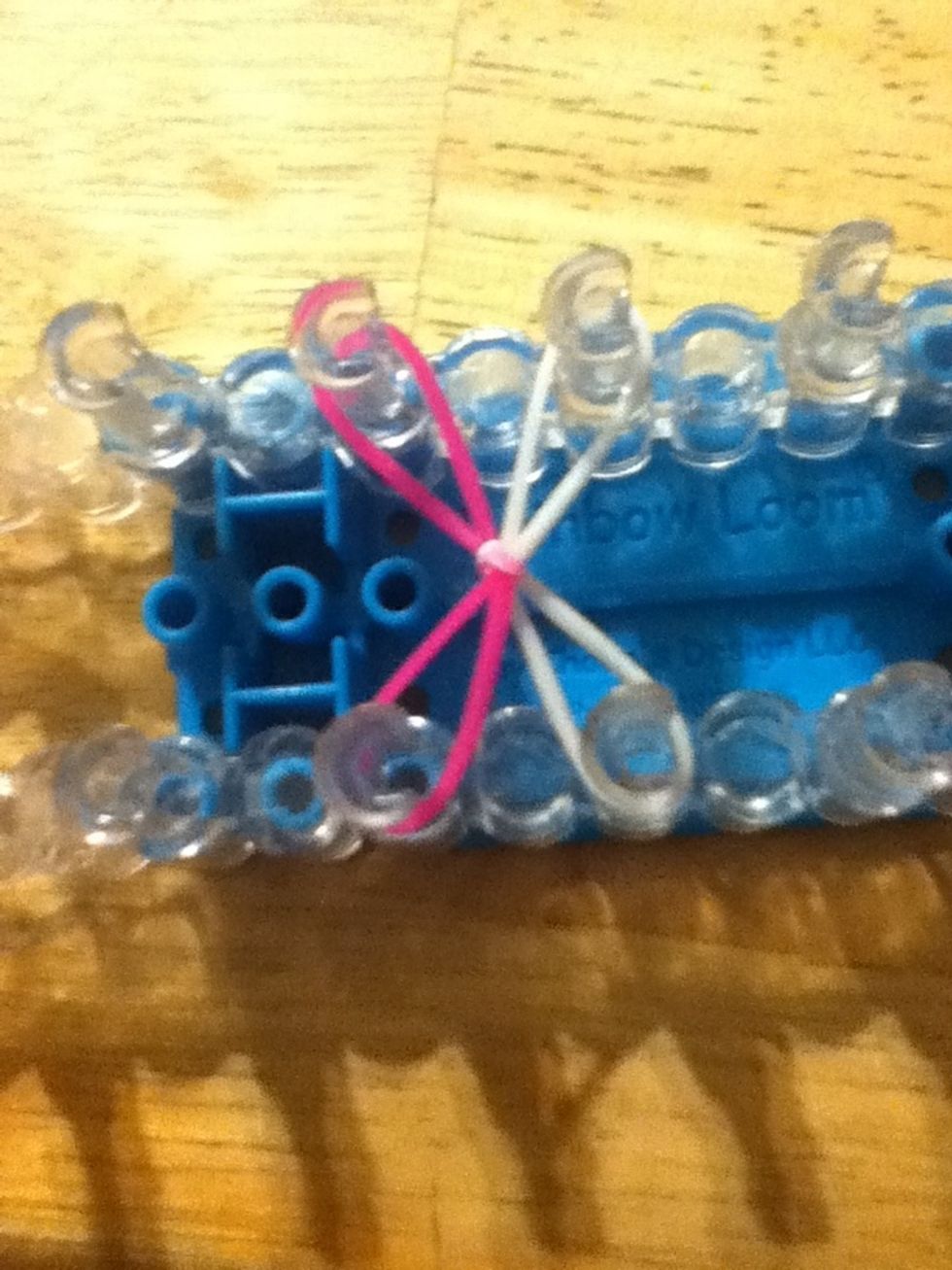 Take another one and put it right beside each other and then they cris-cross over each other as an X.