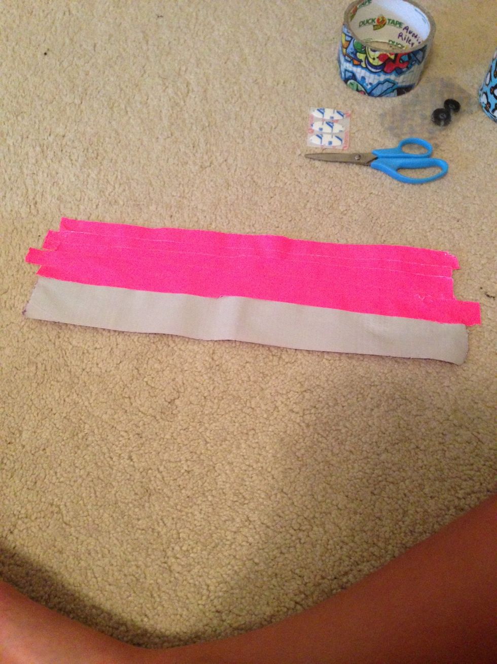 Take another(or the same) colored duck tape and start placing strips on top