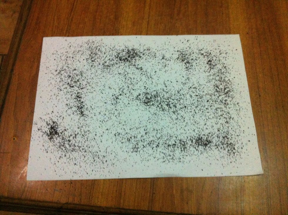 take another paper and spread fresh dry black tea over it