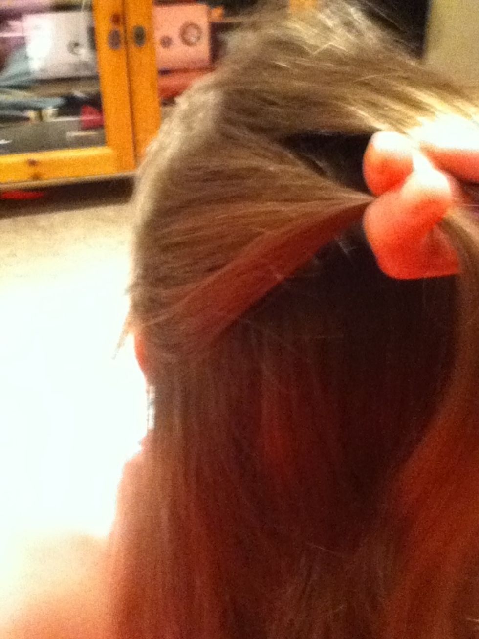 Take another peice from the side of your head, still holding the first peice