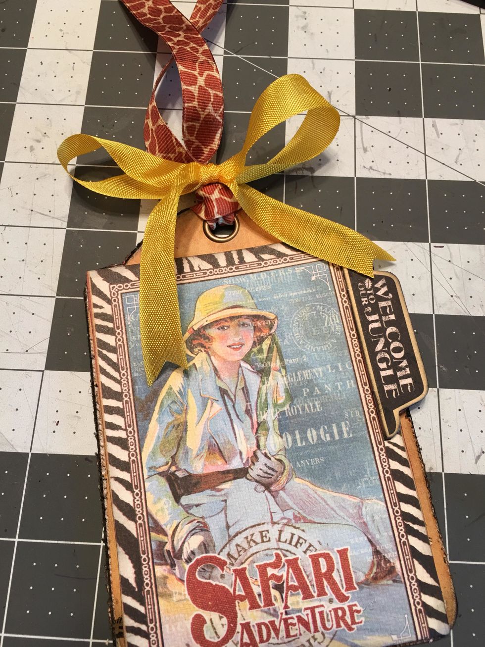 Take another piece of ribbon and tie it in to a bow around the looped ribbon as shown.