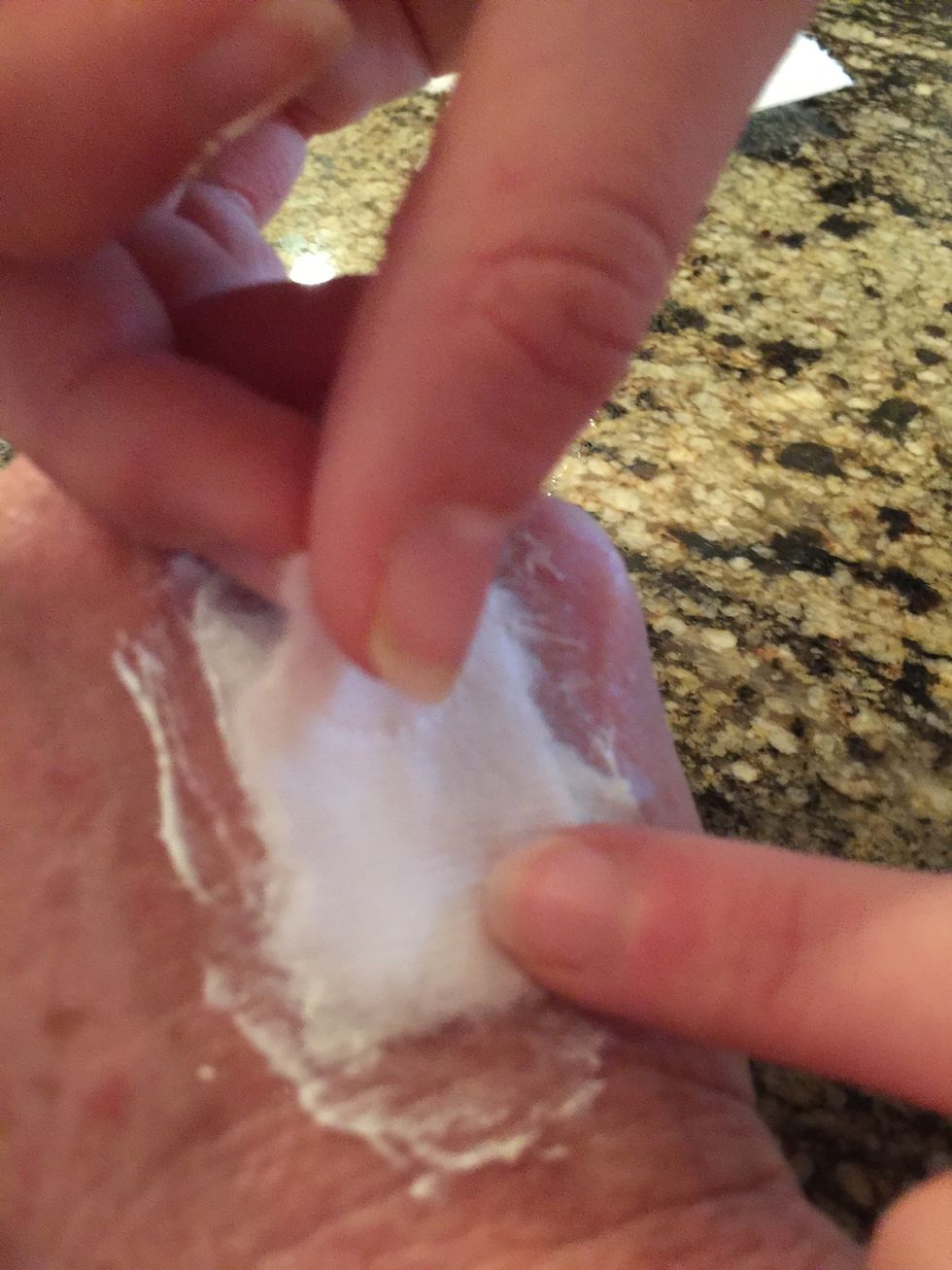 Take another piece of toilet paper and flatten on top of the second layer of the toilet paper.