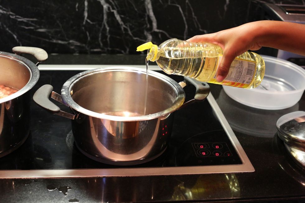 Take another pot and pour the oil then heat the stove and this is for the Lamb Stew