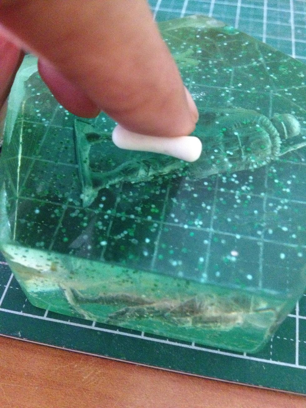 Take another white clay and as before, roll it outwards. This is going to form the 'stalk' of the mushroom.