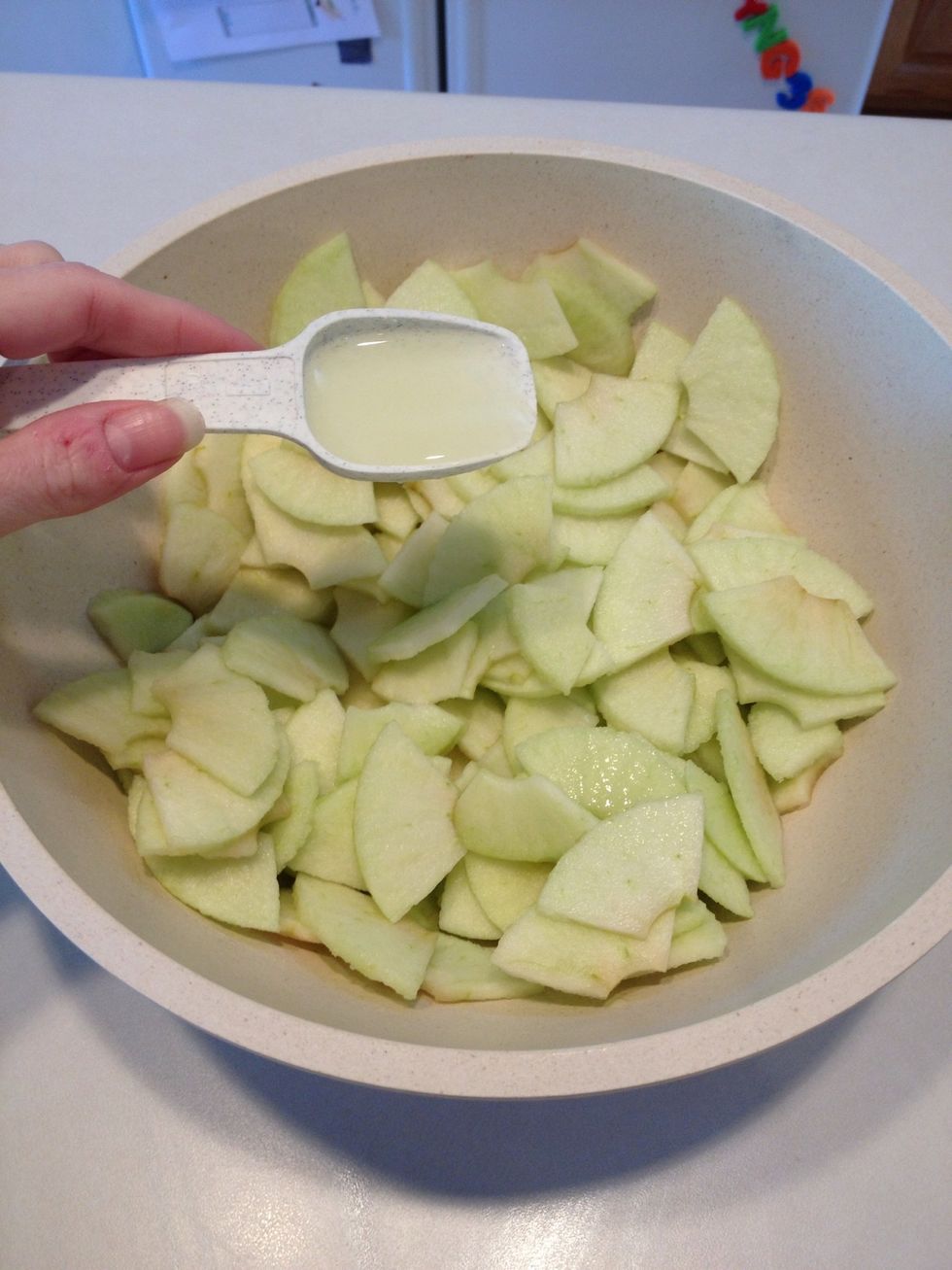 Take apples out of refrigerator and add lemon juice. Stir gently.