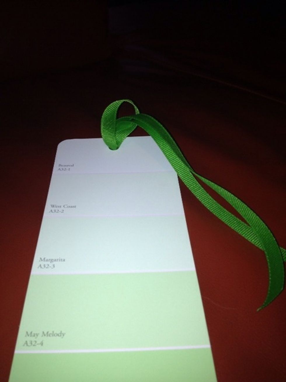 Take both ends of ribbon and thread through loop securing it to the paint chip. Gently pull it tight ( this takes a little nudging and pulling).