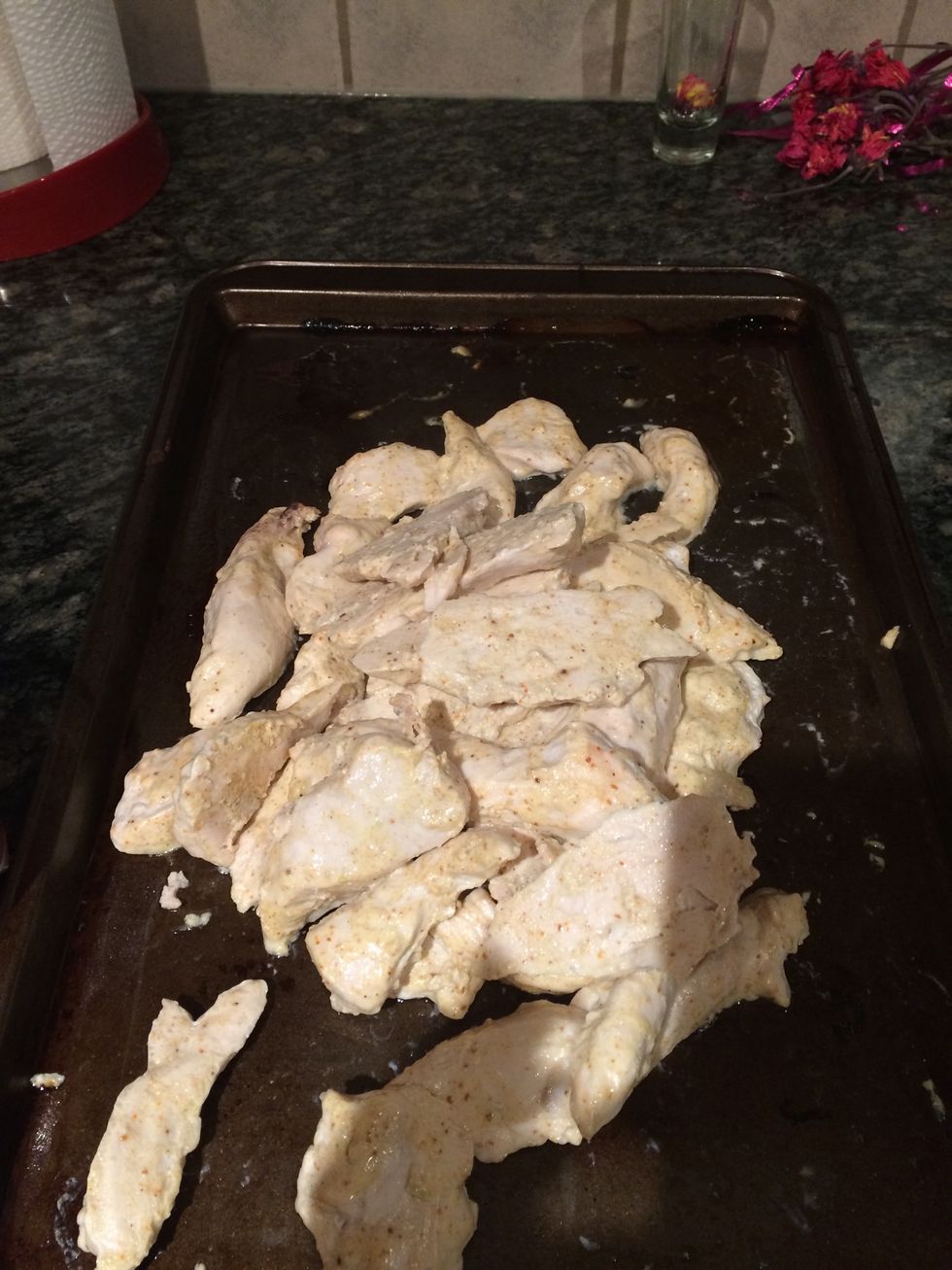 Take chicken out of oven and put aside to drain off liquid on paper towel