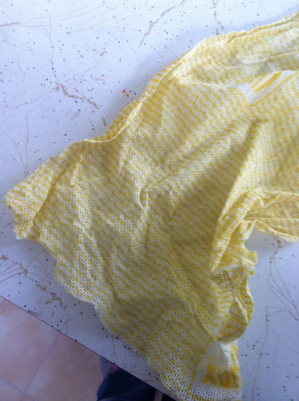 Take cloth and cut it to be just bigger than the open end of our cut bottle