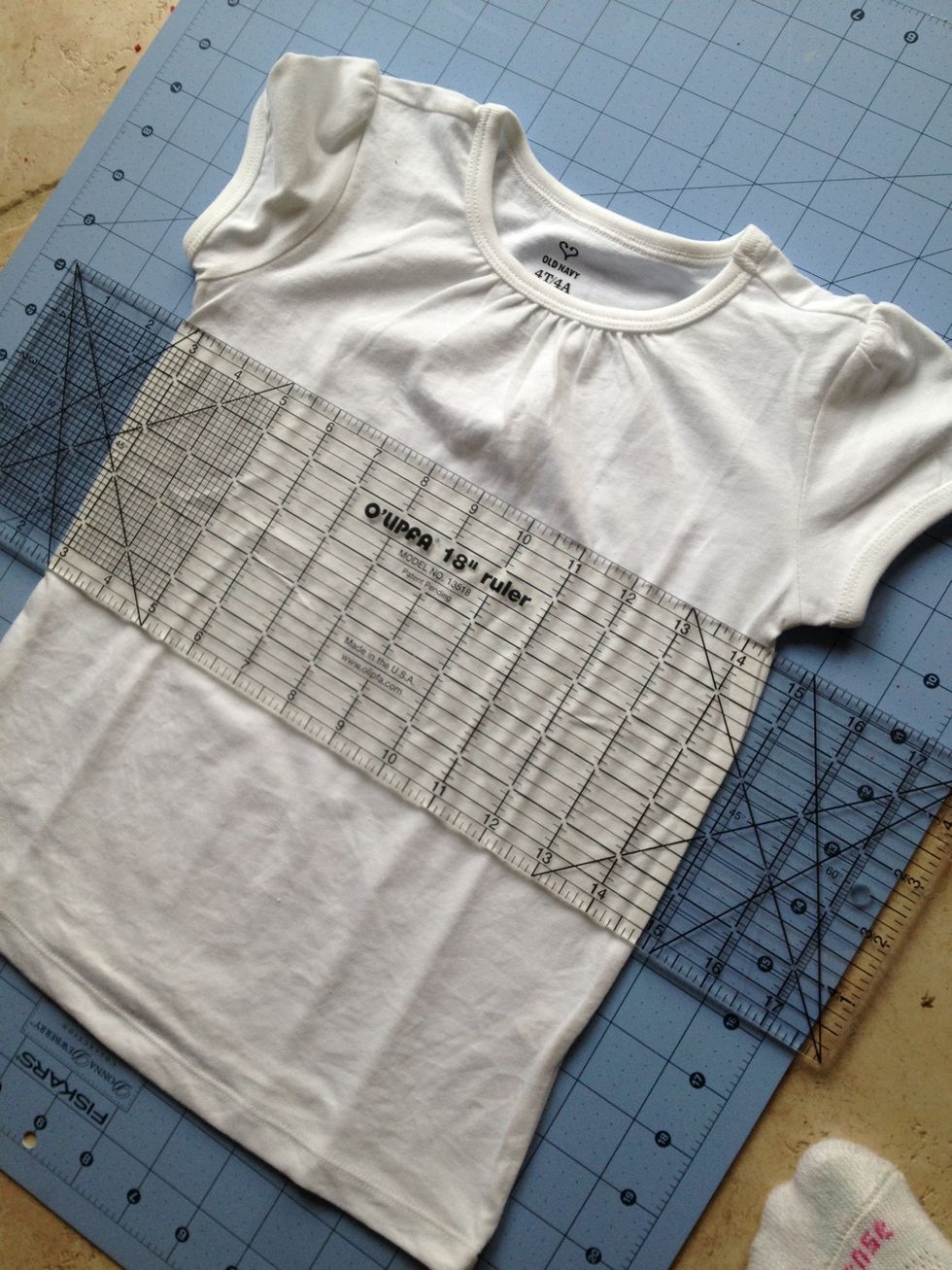 Take coordinating Tshirt, cut one inch below arm pits (save bottom to make a skirt or other project)