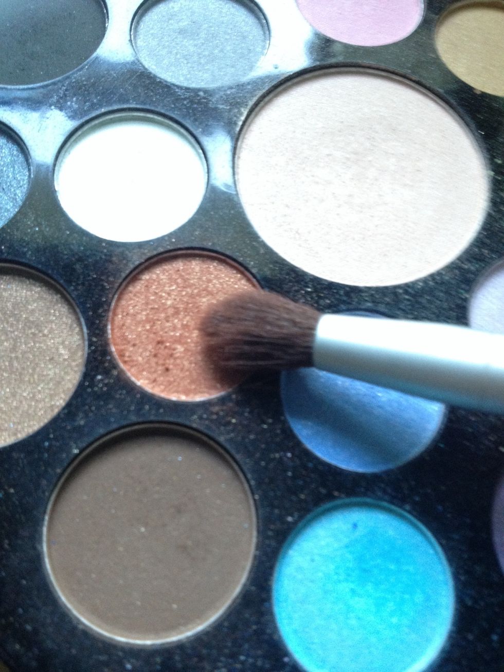 Take dark orange on fluffy brush.