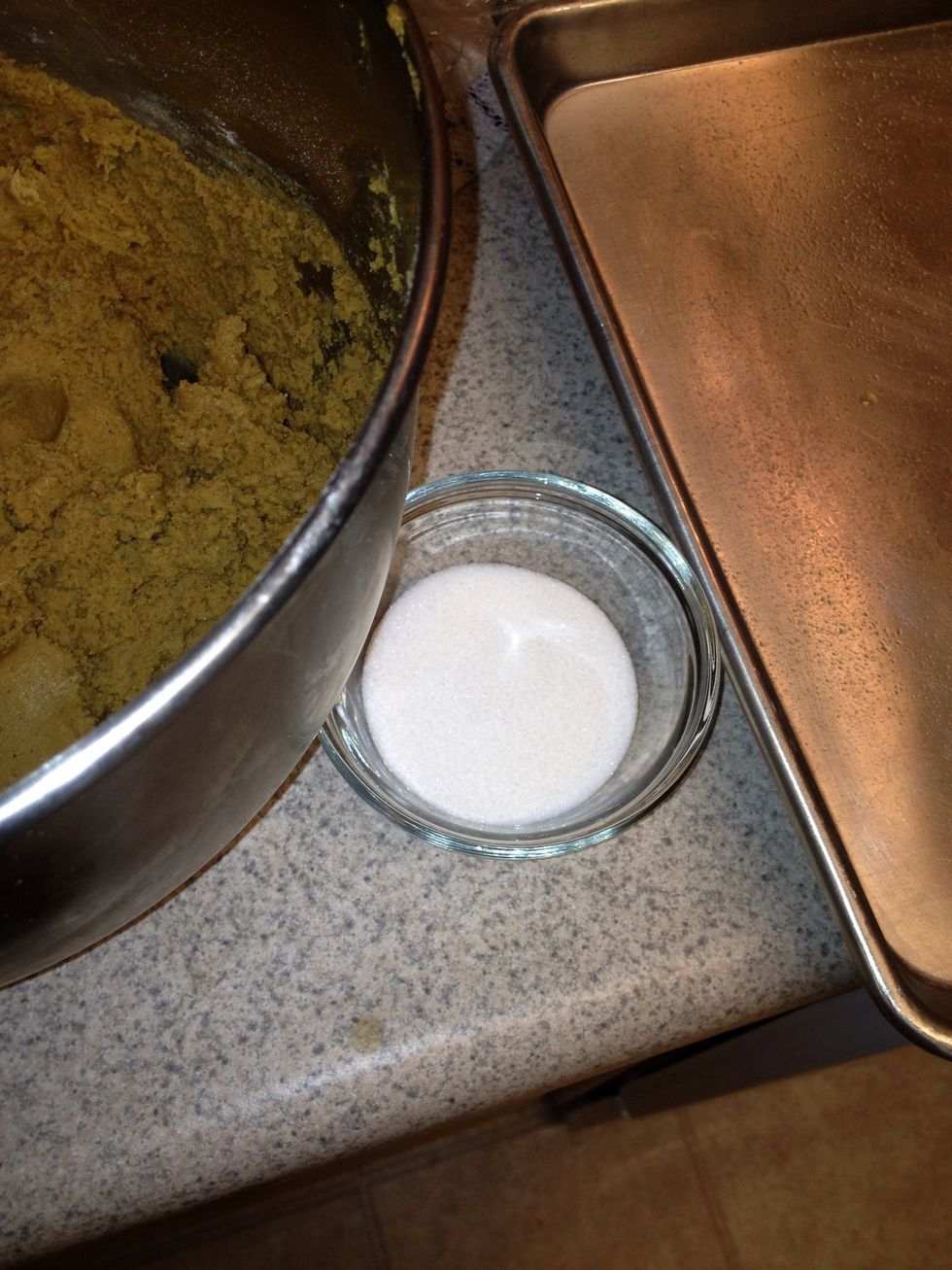 Take dough out after it has chilled for a bit and roll into one inch balls. Roll in sugar until lightly coated and Place on an ungreased cookie sheet. (Sorry for lack of pictures!)