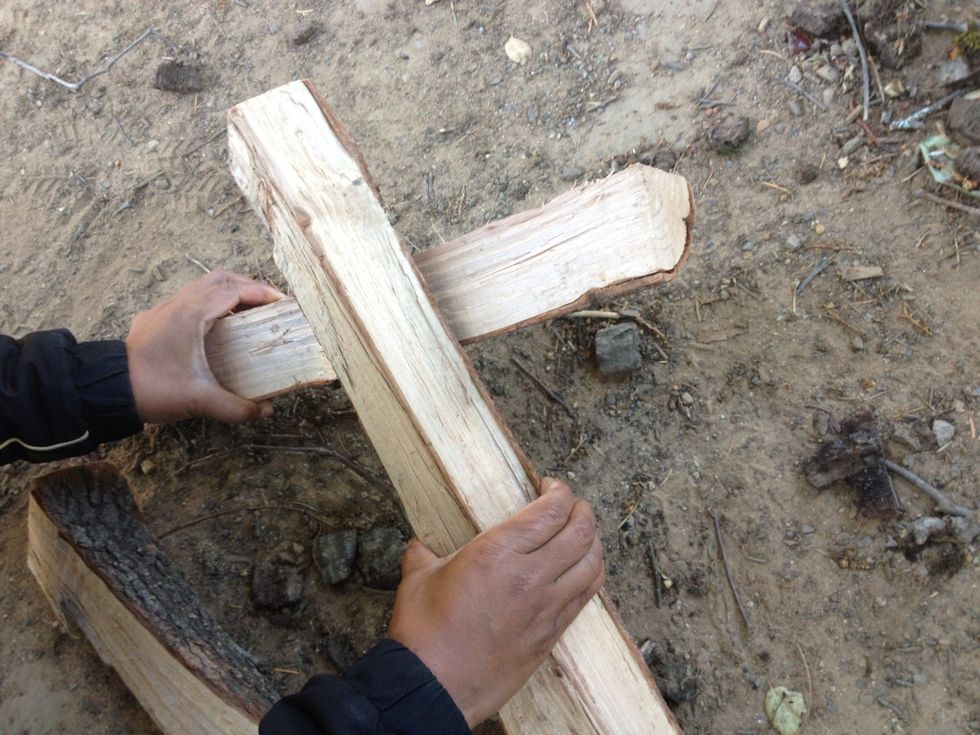 Take first two, place one over the other like an X or cross