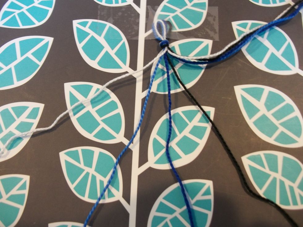 Take group one and put the strings in the order that you want for the bracelet.