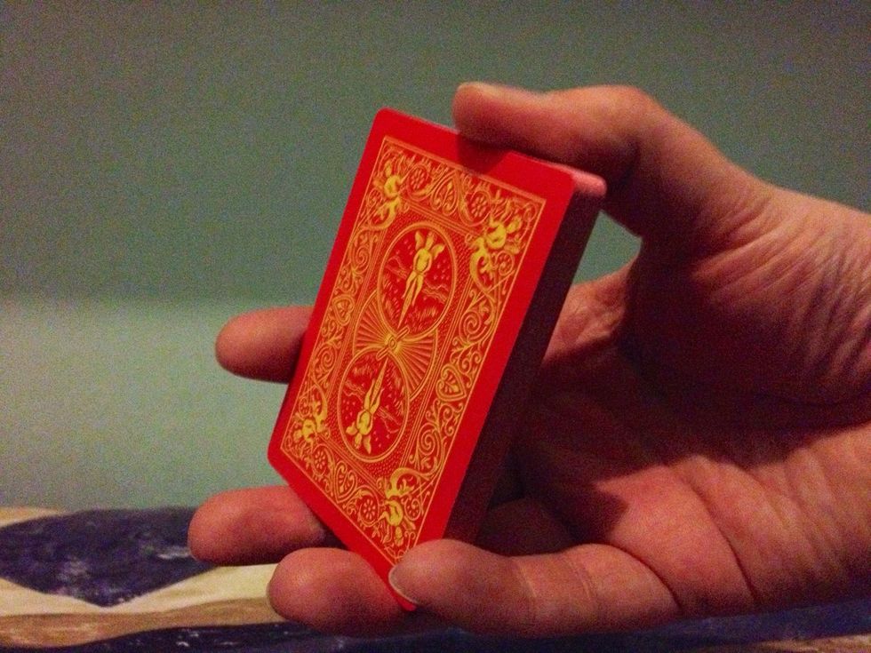 Take half of the deck and hold in this position.
