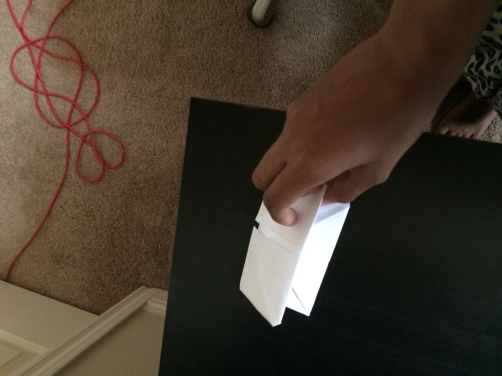 Take it and fold into half.