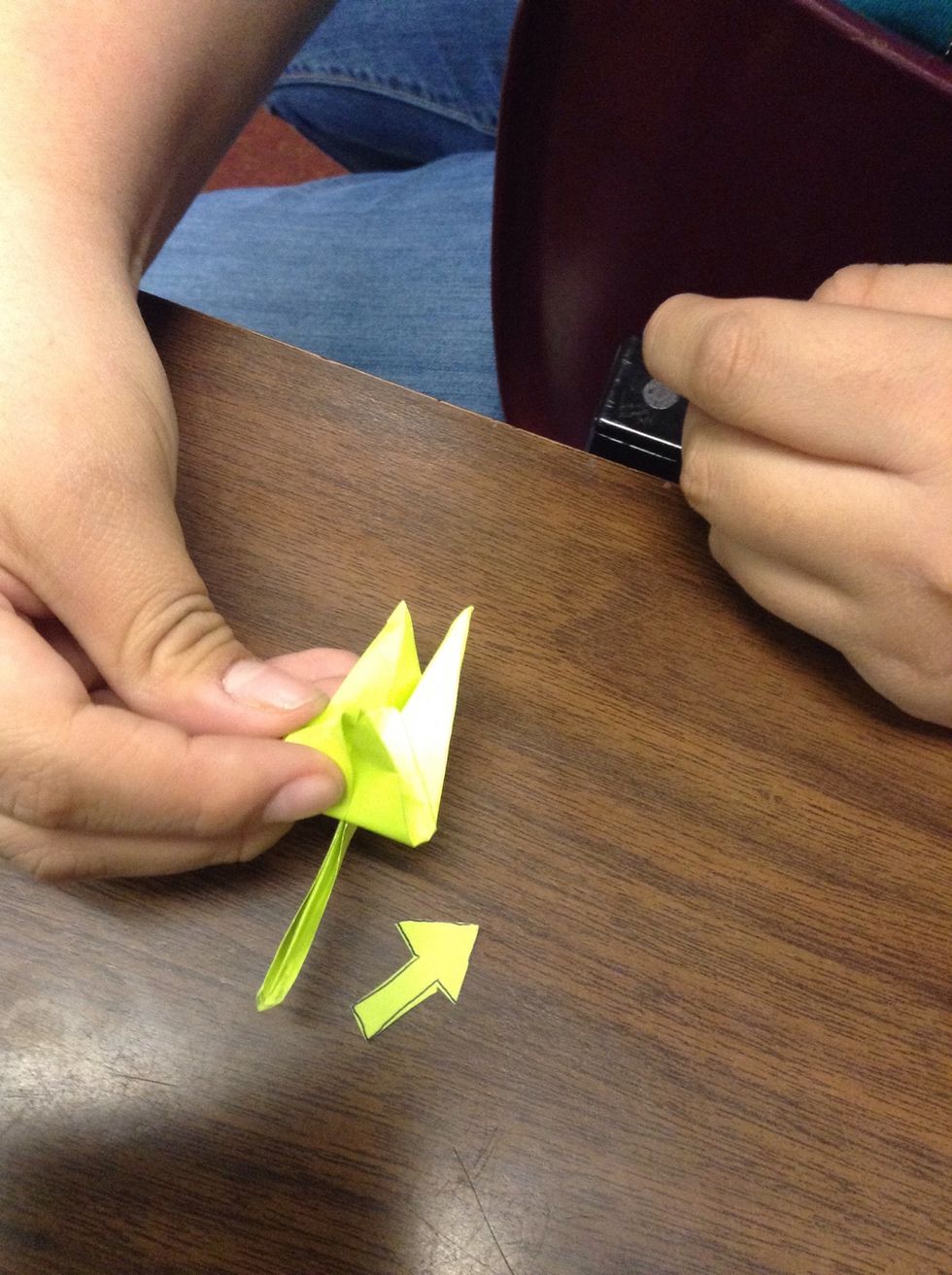 Take it and put it on its side and take one of the little legs and pull it up.
